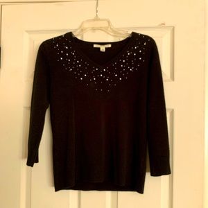 Carolyn Taylor, soft sweater, sprinkled with rhinestones around v-neck line.